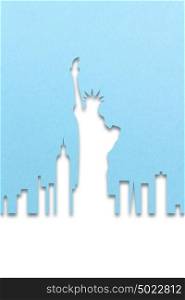 Creative 4th of July concept photo of New York city made of paper on blue background.