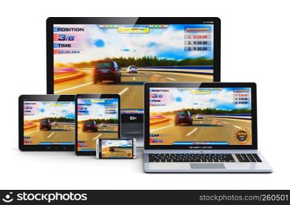 Creative abstract computer gaming and entertainment technology concept: modern black gamer desktop PC, laptop or notebook, tablet and metal glossy touchscreen smartphone with auto racing sport video game isolated on white background