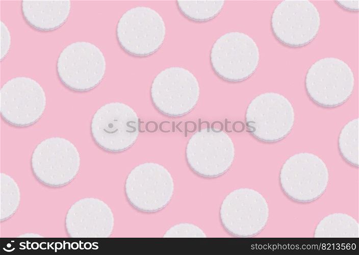 Creative art made with cookies pattern on pastel pink background. Minimalism flat lay top view. Creative art made with cookies pattern on pastel pink background