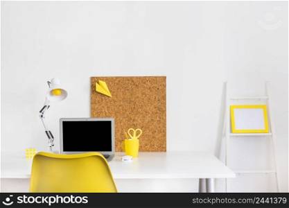 creative bright cabinet with yellow chair cork board