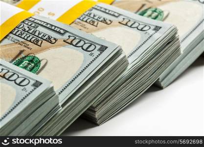 Creative business finance making money concept - background of new 100 US dollars 2013 edition banknotes bills bundles close up