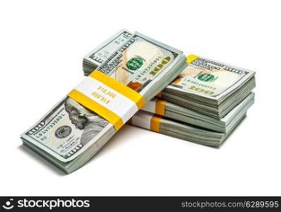 Creative business finance making money concept - stack of bundles of 100 US dollars 2013 edition banknotes bills isolated on white
