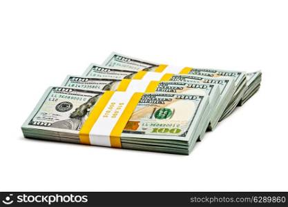 Creative business finance making money concept - stack of bundles of 100 US dollars 2013 edition banknotes bills isolated on white