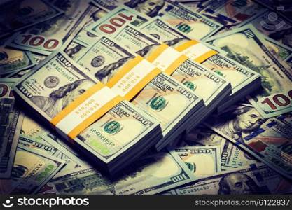 Creative business finance making money concept. Vintage retro effect filtered hipster style image of background of of new 100 US dollars 2013 edition banknotes bills bundles close up. Background of new 100 US dollars 2013 banknotes