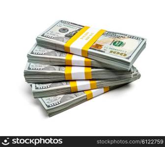 Creative business finance making money wealth success concept - stack of bundles of 100 US dollars 2013 edition banknotes bills isolated on white. Bundles of 100 US dollars 2013 edition banknotes