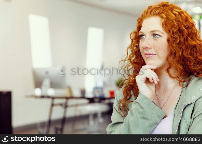 Creative business woman in office. Young and pretty business woman in office
