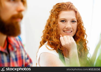 Creative business woman in office. Young and pretty business woman working in office