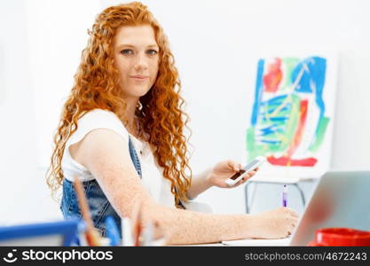 Creative business woman in office. Young and pretty business woman working in office