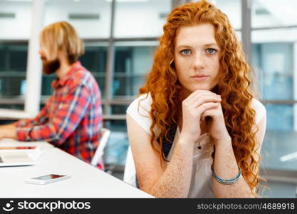 Creative business woman in office. Young and pretty business woman working in office