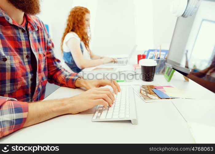 Creative business woman in office. Young and pretty business woman working in office