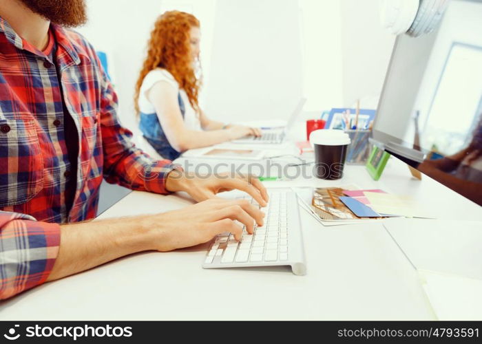 Creative business woman in office. Young and pretty business woman working in office