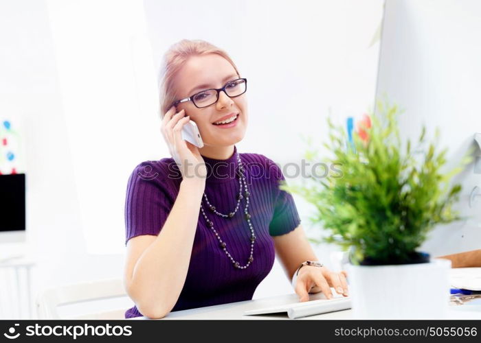 Creative business woman in office. Young and pretty business woman working in office