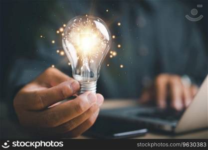 Creative businessman holds a light bulb, representing an innovative idea. Highlights the concept of brainstorming, solution, and successful profit in global business.