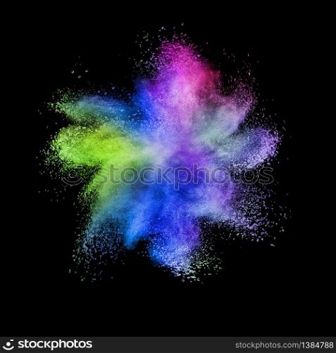 Creative chaotic multicolored powder explosion or splash on a black background with copy space.. Abstract colorful powder explosion on a black background.