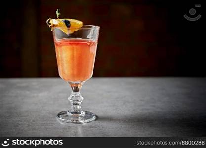 Creative cocktail with orange juice on background.. Creative cocktail with orange juice