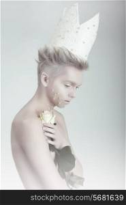 Creative Concept. Man in Crown with Flowers