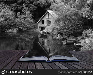 Creative concept pages of book Black and white retro style picture of derelict boathouse and rowing boats landscape