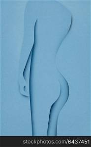 Creative concept photo of body made of paper on blue background.