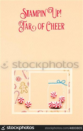 Creative concept photo of christmas candies in an illustrated bottle on brown background.