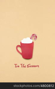 Creative concept photo of christmas coffee cup made of paper on brown background.