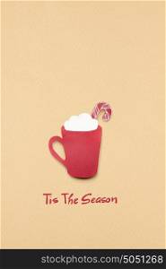 Creative concept photo of christmas coffee cup made of paper on brown background.