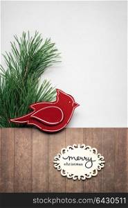 Creative concept photo of christmas tree and bird with sign on brown grey background.