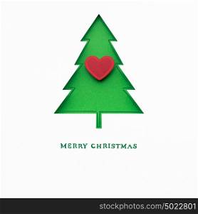Creative concept photo of christmas tree with heart made of paper on white background.