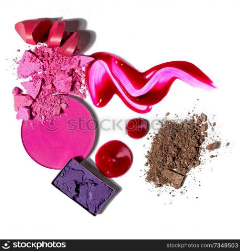 Creative concept photo of cosmetics swatches beauty products lipstick lip gloss square and round eyeshadow on white background.