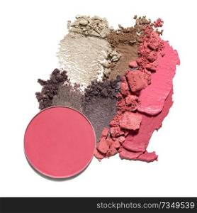 Creative concept photo of cosmetics swatches beauty products lipstick round eyeshadow on white background.