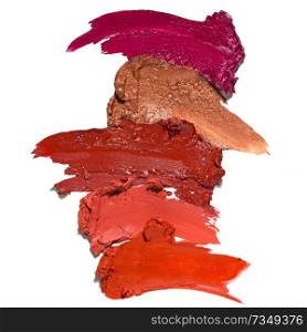 Creative concept photo of cosmetics swatches beauty products lipstick white background.