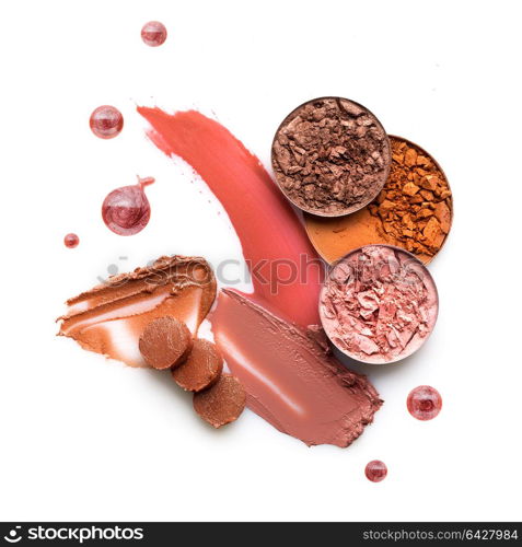 Creative concept photo of cosmetics swatches on white background.