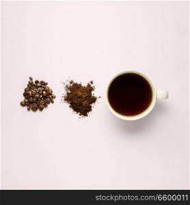 Creative concept photo of cup beans and instant coffee on grey background.