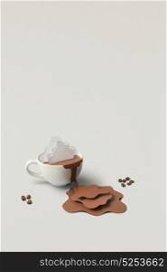 Creative concept photo of cup with splashing coffee made of paper on grey background.