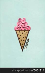 Creative concept photo of ice cream with buttons made of paper on mint background.