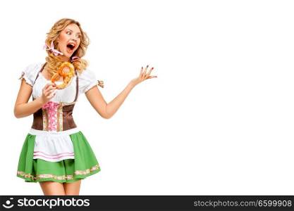 Creative concept photo of Oktoberfest waitress wearing a traditional Bavarian costume with pretzels isolated on white background.