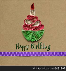 Creative concept photo of quilling birthday cake made of paper on brown background.