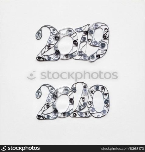 Creative concept photo set of 2019 and 2020 sign made of paper on white background.