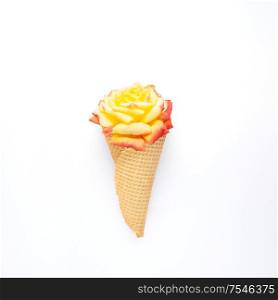 Creative concept still life nature green photo of flowers in bloom with food sweet ice cream waffle cone on white background.