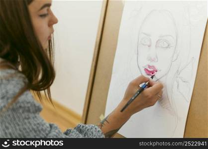 creative contemporary painter making portrait