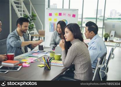 Creative design office center working teamwork. Happy business people partner plan strategy organization research people together at diversity office using laptop, smartphone company conference room