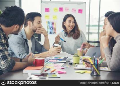 Creative design office center working teamwork. Happy business people partner plan strategy organization research people together at diversity office using laptop, smartphone company conference room