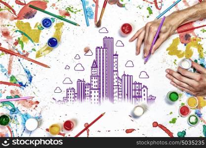 Creative design work. Colorful sketch of construction project on white paper