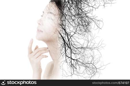 Creative double exposure of portrait beautiful fashion of woman isolated on white background, silhouette of girl with branches of tree, environment concept.