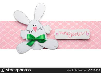 Creative easter concept photo of a rabbit made of paper on pink white background.