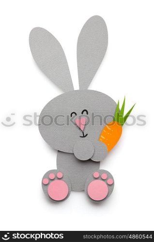 Creative easter concept photo of a rabbit with a carrot made of paper on white background.