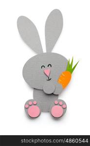 Creative easter concept photo of a rabbit with a carrot made of paper on white background.