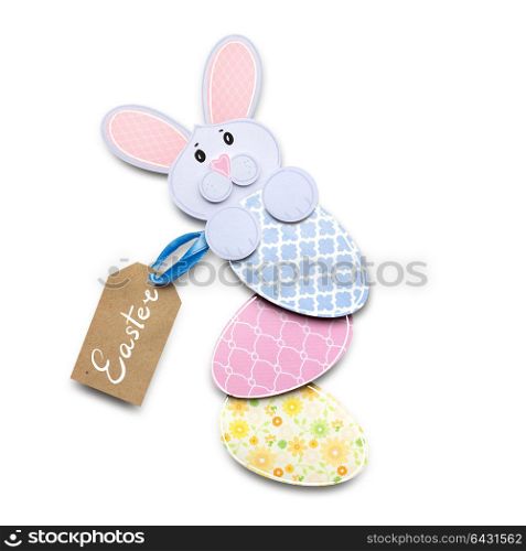 Creative easter concept photo of a rabbit with an egg made of paper on white background.