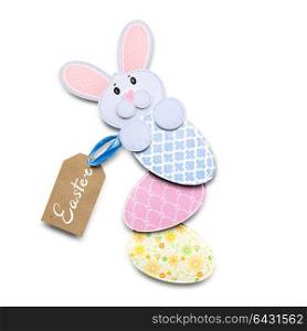 Creative easter concept photo of a rabbit with an egg made of paper on white background.