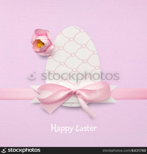Creative easter concept photo of an egg made of paper on pink background.