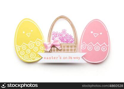Creative easter concept photo of eggs and basket made of paper on white background.